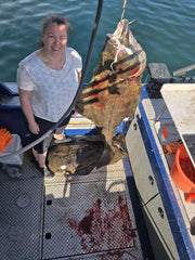 10 Ounce Herring Pattern Blue Guppy Jig with grub tail.