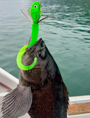 10 Ounce Mean Green UV Guppy Jig with grub tail.