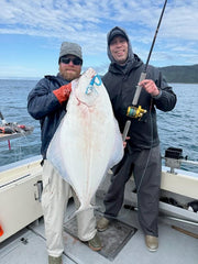 10 Ounce Herring Pattern Blue Guppy Jig with grub tail.