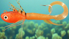 10 Ounce UV Nova Orange Guppy Jig with grub tail